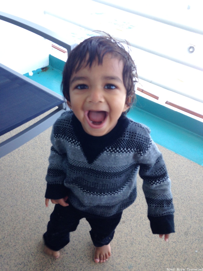 Happy toddler on the balcony