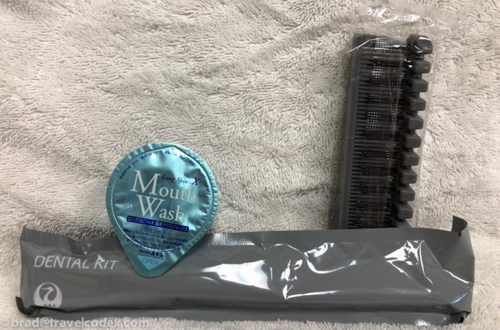 a toothbrush and toothpaste on a towel