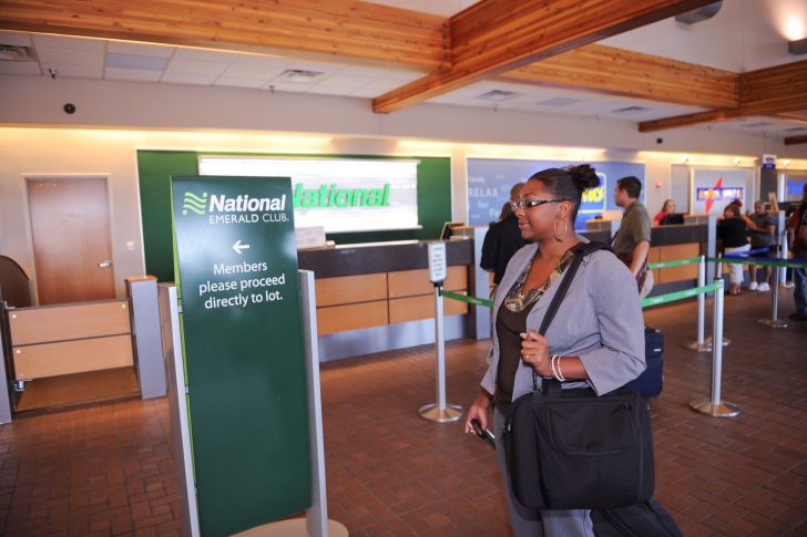 a woman standing in a check-in counter