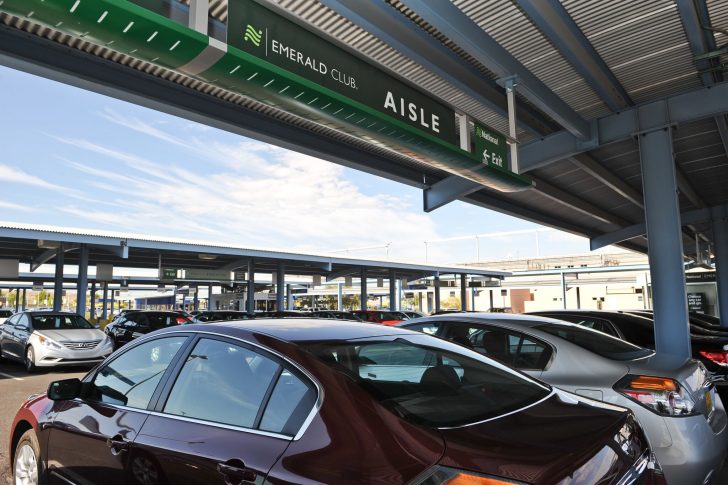 a group of cars parked under a covered area