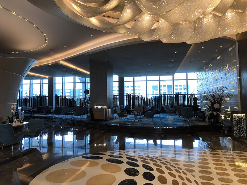 a large room with a large ceiling and a large window