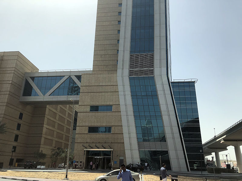 a tall building with glass windows