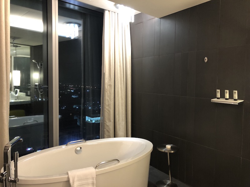 a bathroom with a tub and shower