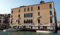 a building with boats on the water