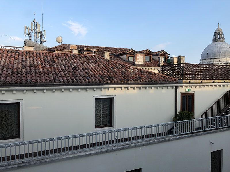a building with a railing and a balcony