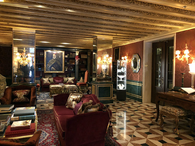 a room with a piano and couches