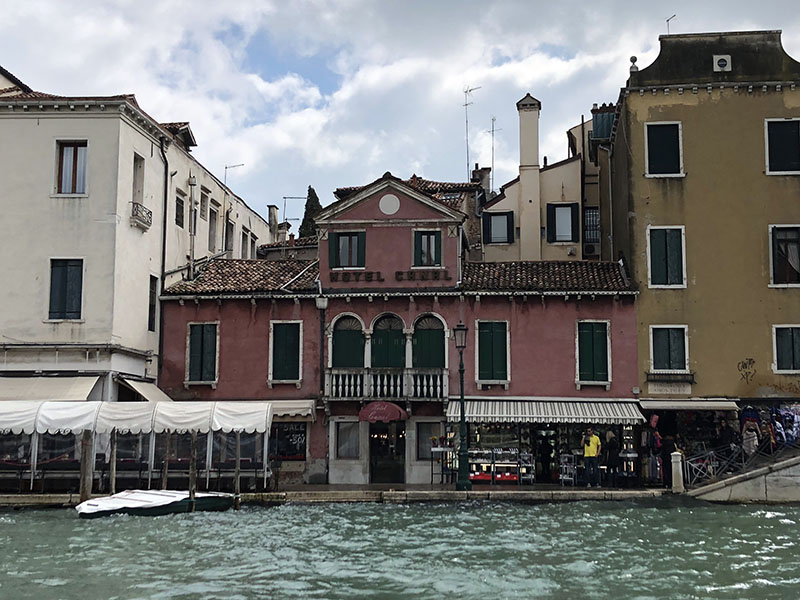 a building next to a body of water