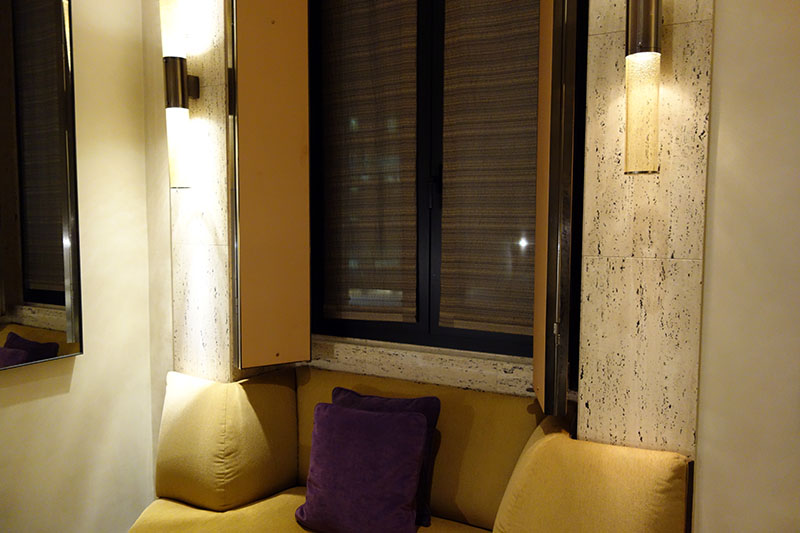 a couch with pillows and lights