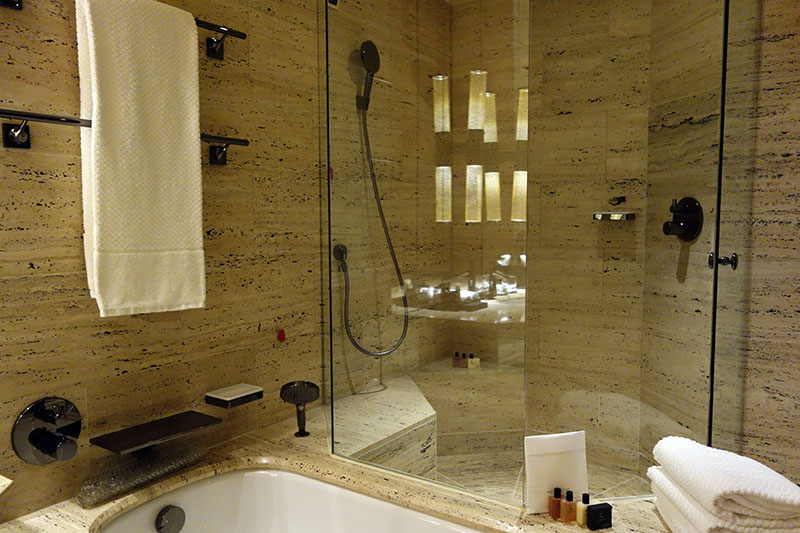 a bathroom with a glass shower door