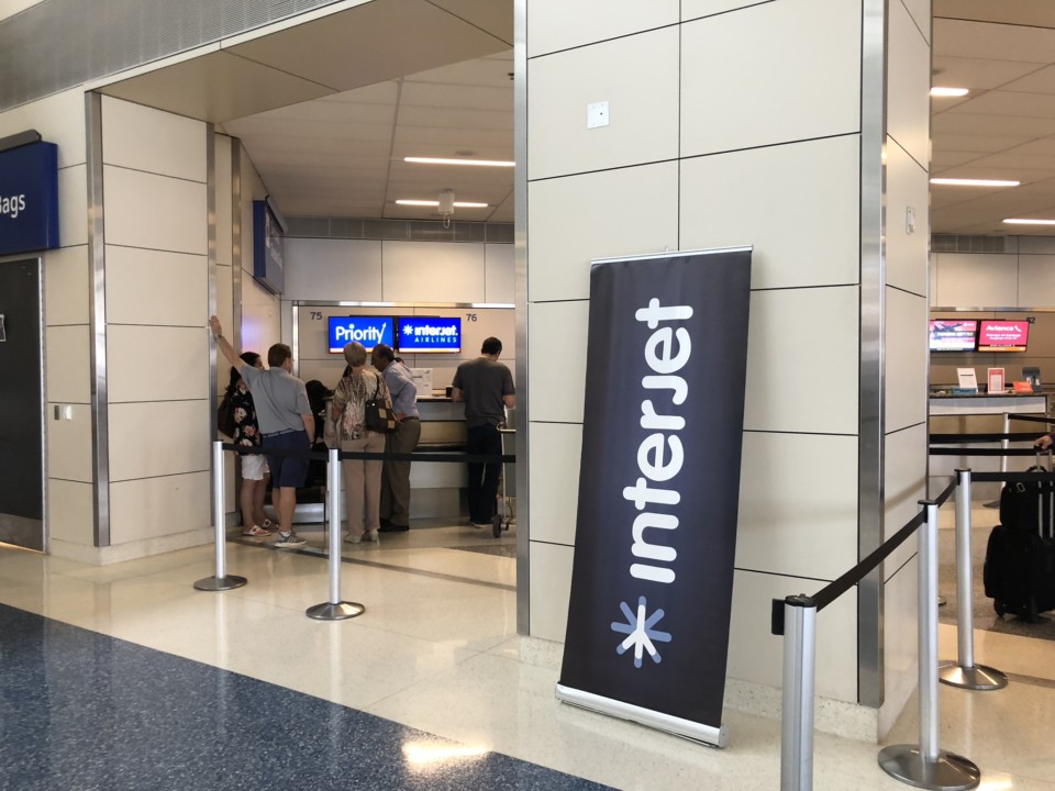 people standing in front of a sign