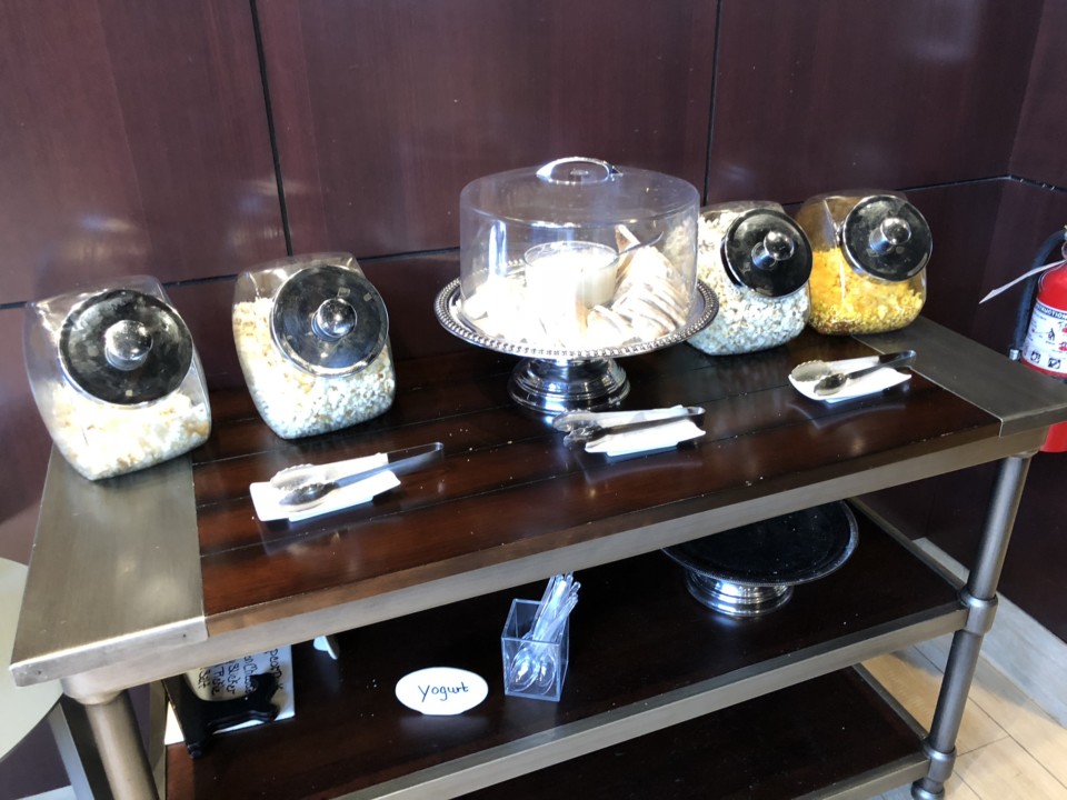 a table with food containers and spoons