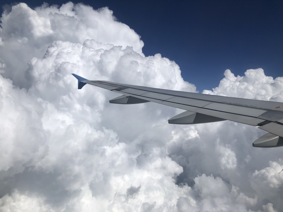 an airplane wing in the sky