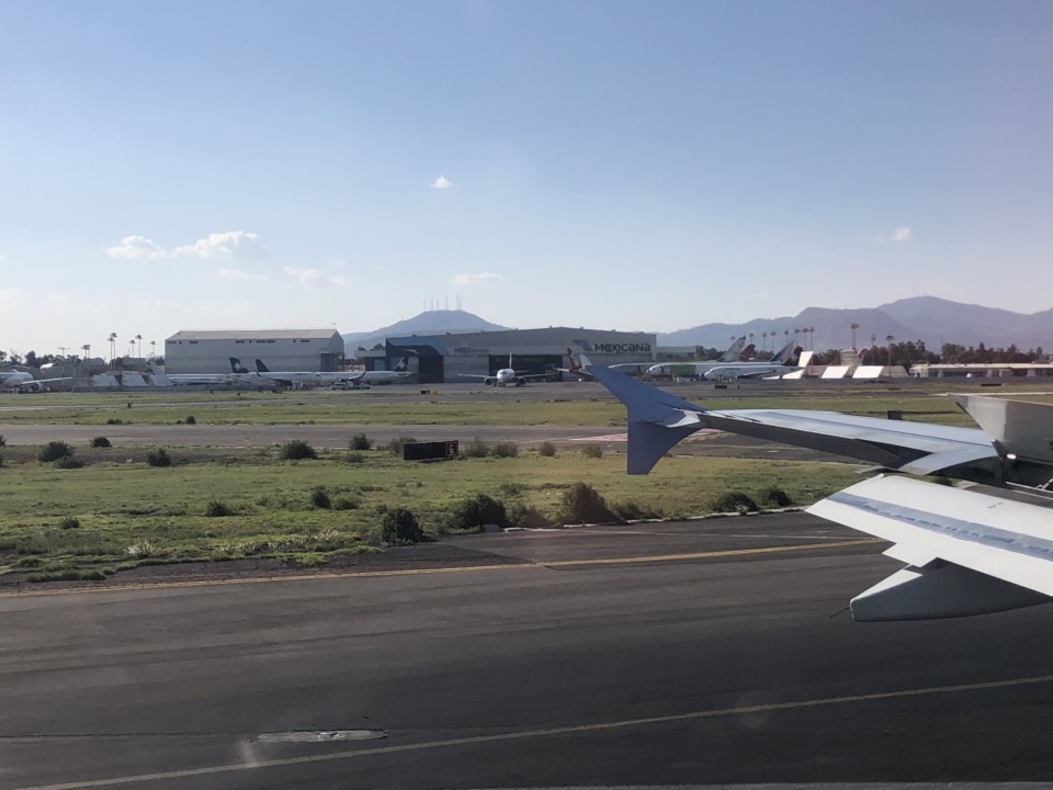 an airplane wing on a runway