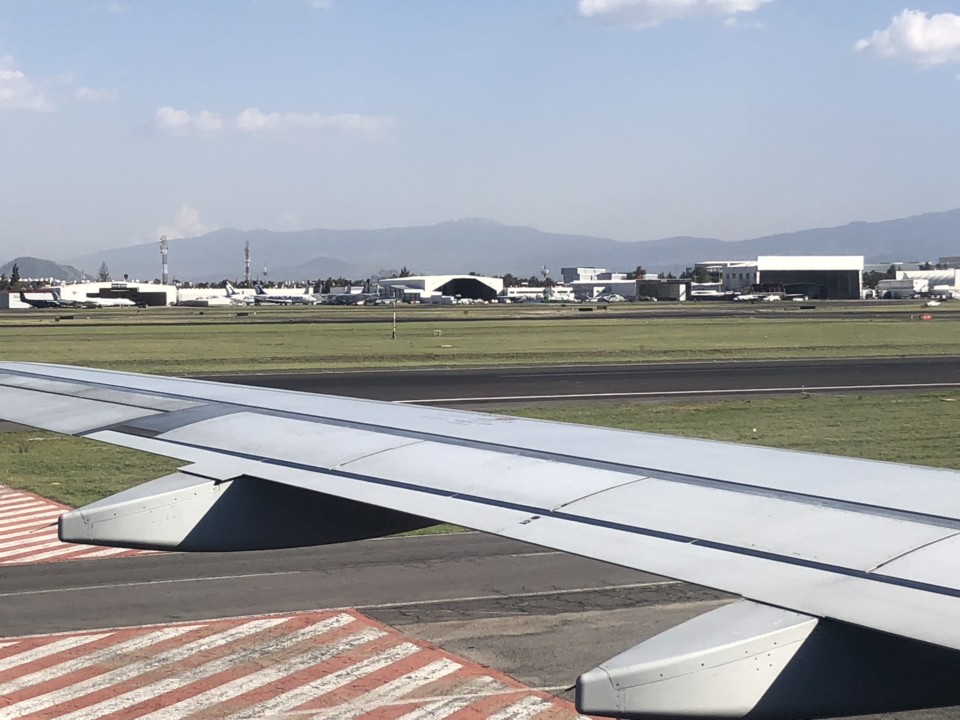 an airplane wing on a runway