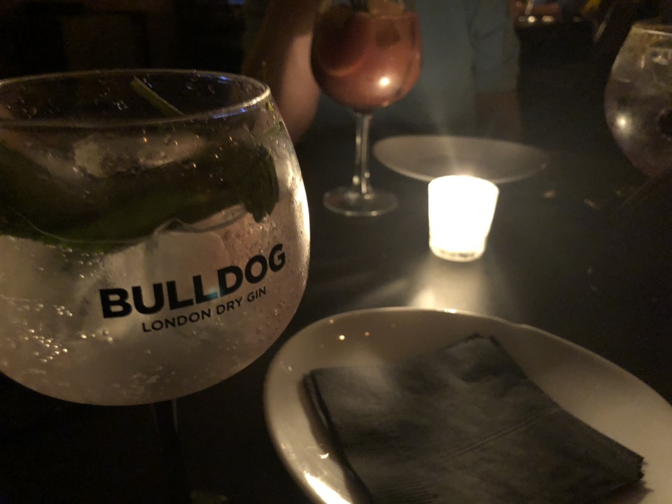 a glass of liquid on a table