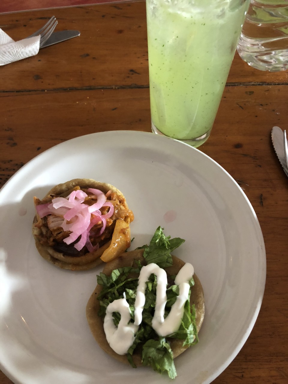 food on a plate next to a drink