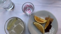 a plate of food and a glass of water