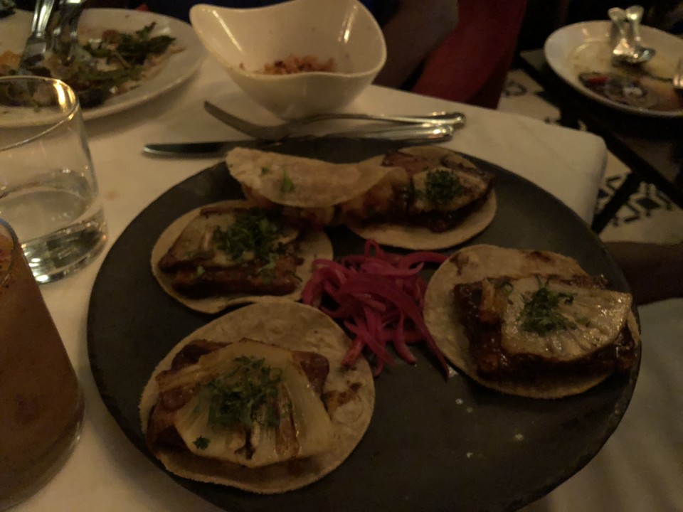 a plate of tacos on a table