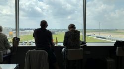 a man and woman sitting by a window