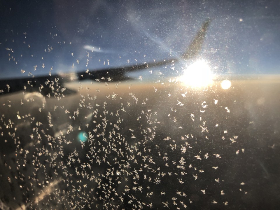 a sun and clouds in the sky