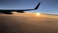an airplane wing in the sky