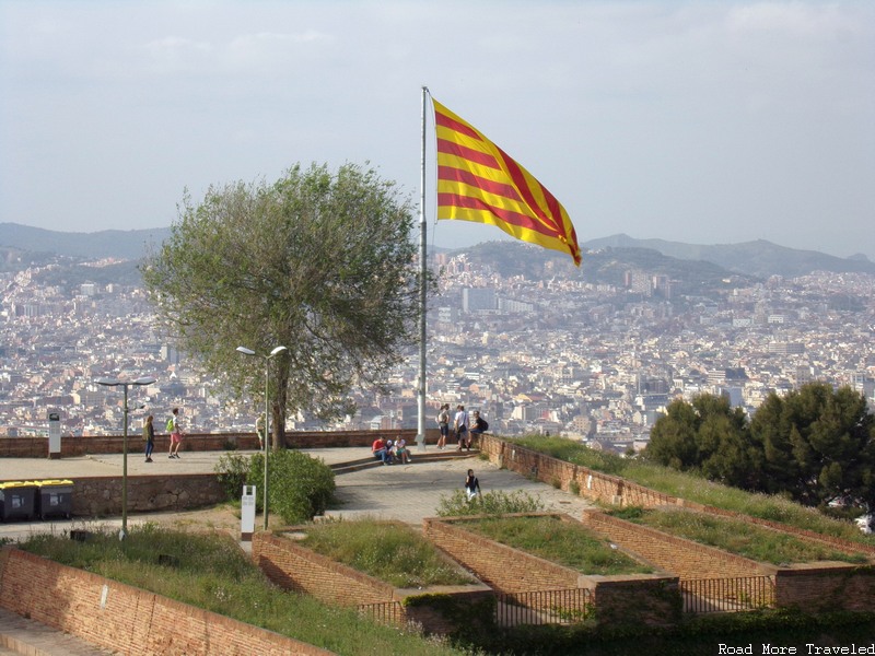 Montjuic Castle - city view behind flag