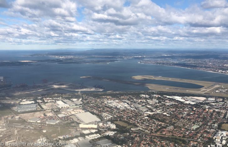 an aerial view of a city and water