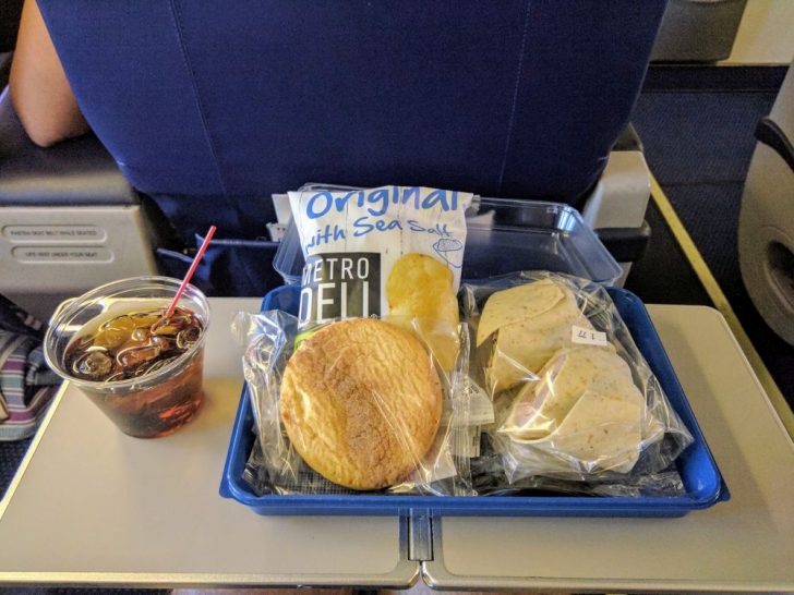 a tray of food and drink on a table