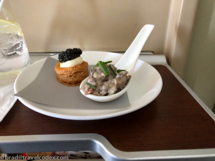 a spoon on a plate with food on it