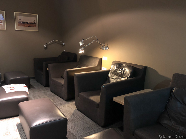 a room with black chairs and a table