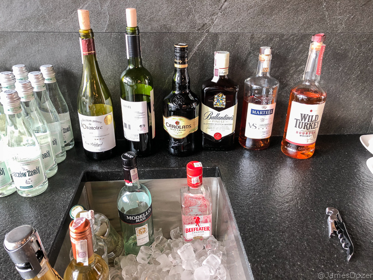 a group of bottles of alcohol in a sink