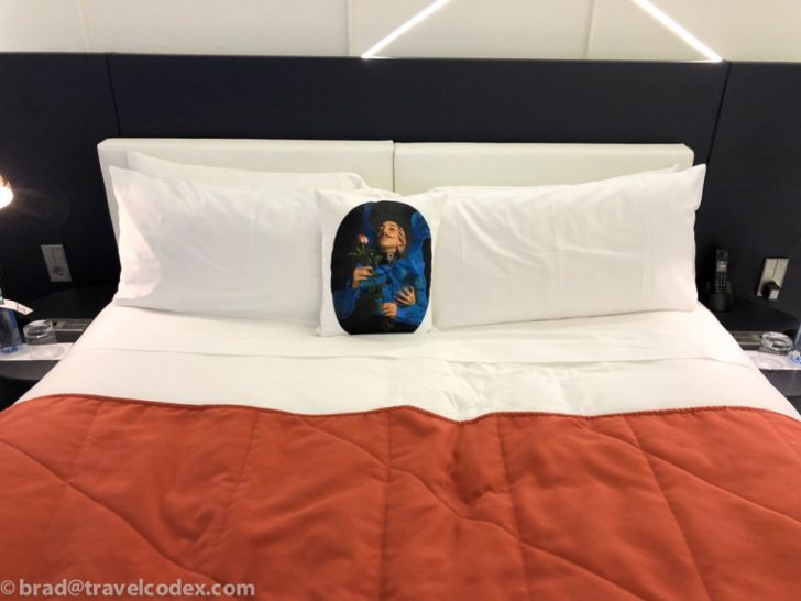 a bed with a pillow on it