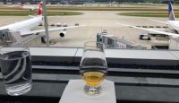 a glass of alcohol on a table