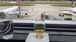 a glass of alcohol on a table