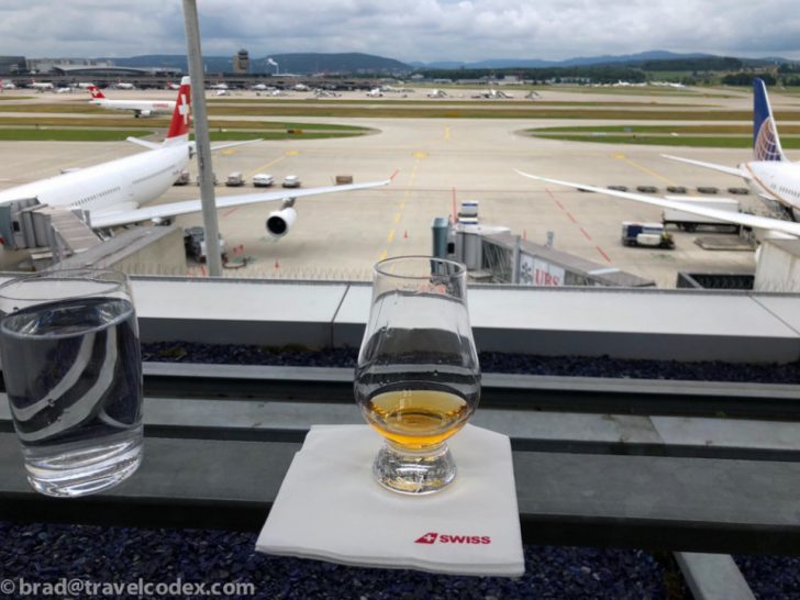 two glasses of alcohol on a table