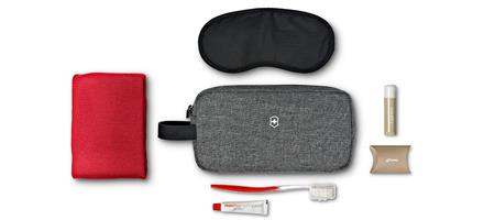 a grey and red travel kit
