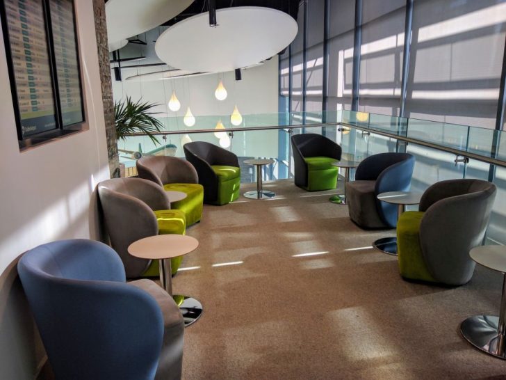 a room with chairs and tables