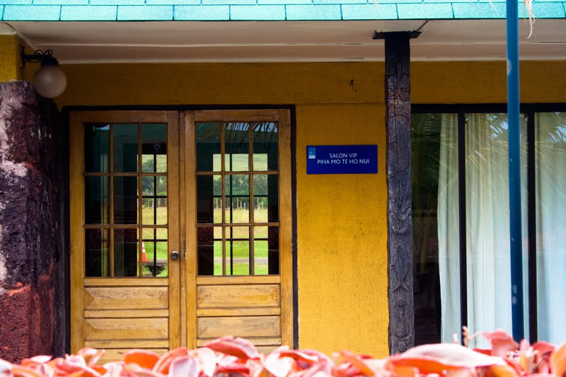 a yellow building with a sign on the front
