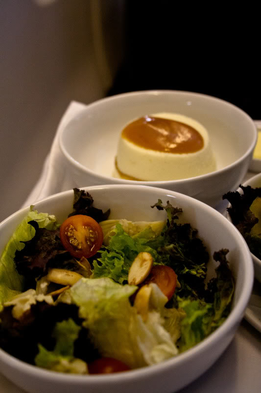 a bowl of salad and a dessert