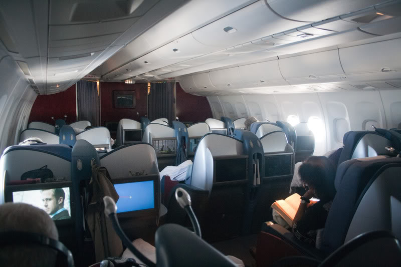 a plane with people sitting in chairs