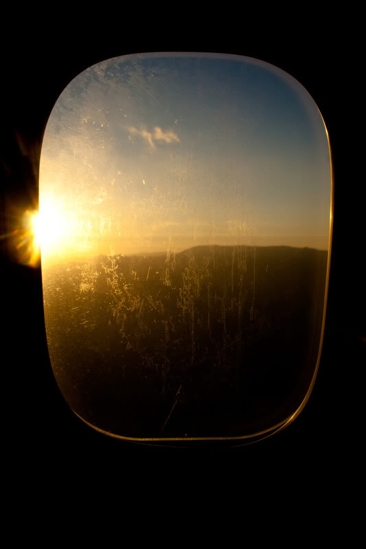 a sun shining through a window