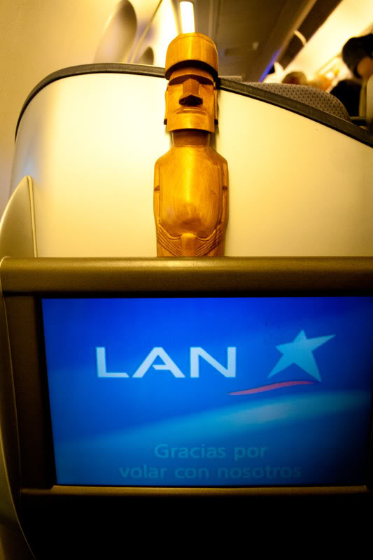 a wooden statue on top of a television