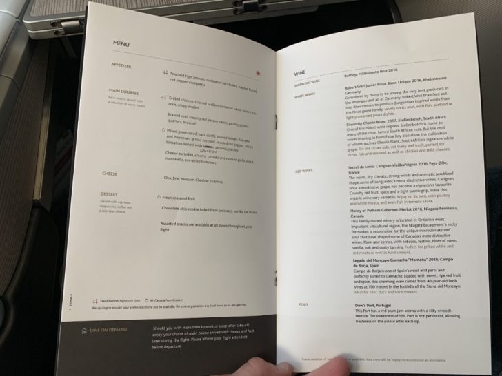 a hand holding a menu