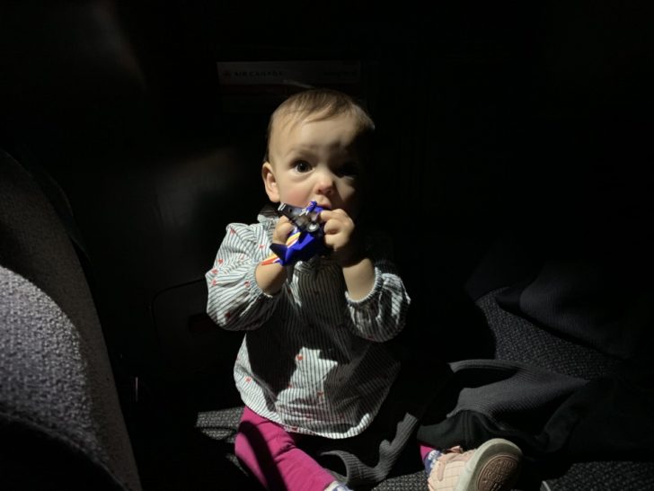 a baby holding a toy in his mouth