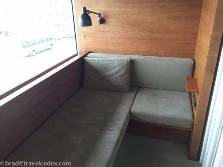 a couch with a lamp and a table