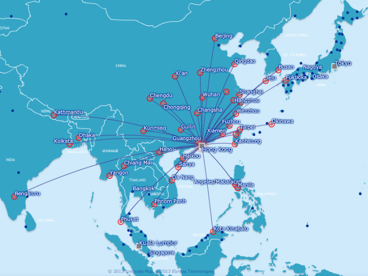 a map of the world with red dots and white text