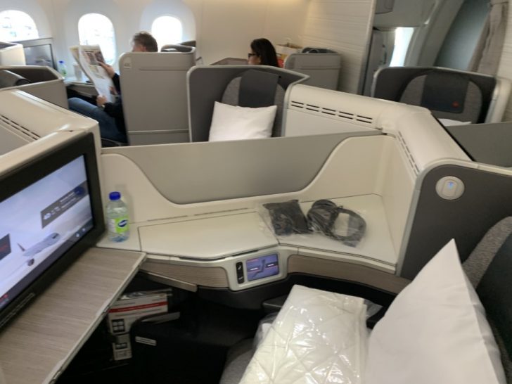 a tv and a table in an airplane