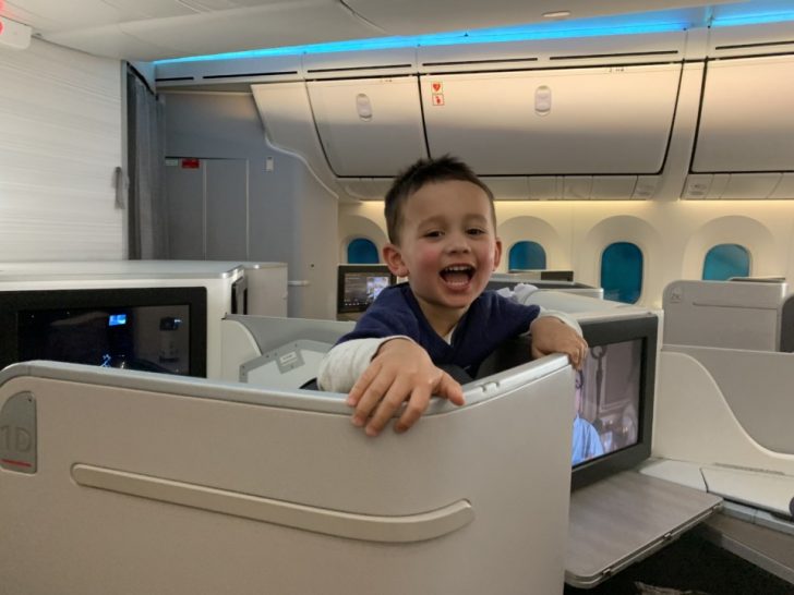 a boy sitting in an airplane
