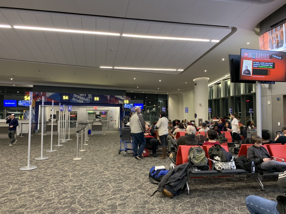 a group of people sitting in a waiting area