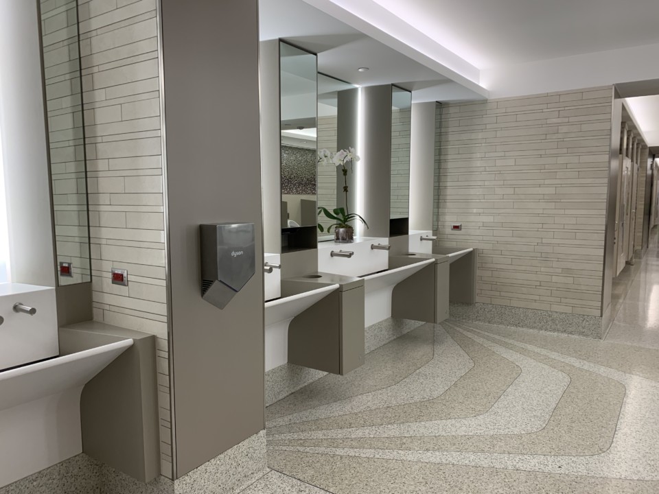 a bathroom with sinks and mirrors